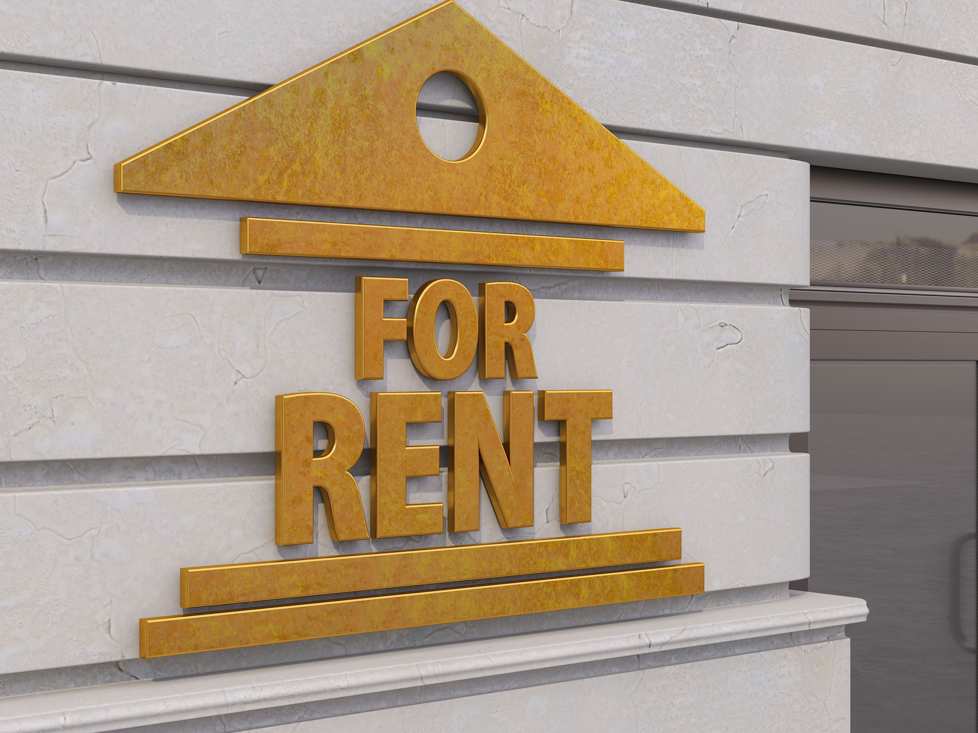 For Rent Real Estate Sign on Building's Wall